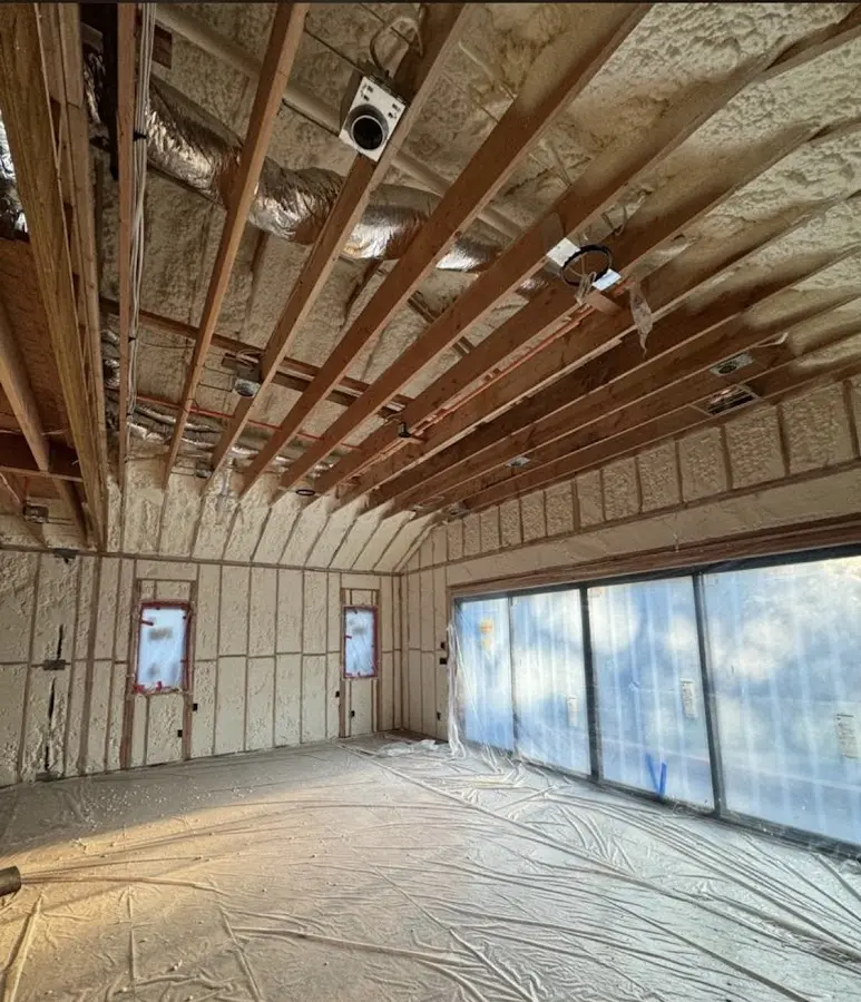 Interior walls and ceiling insulated with spray foam during new construction in East Windsor